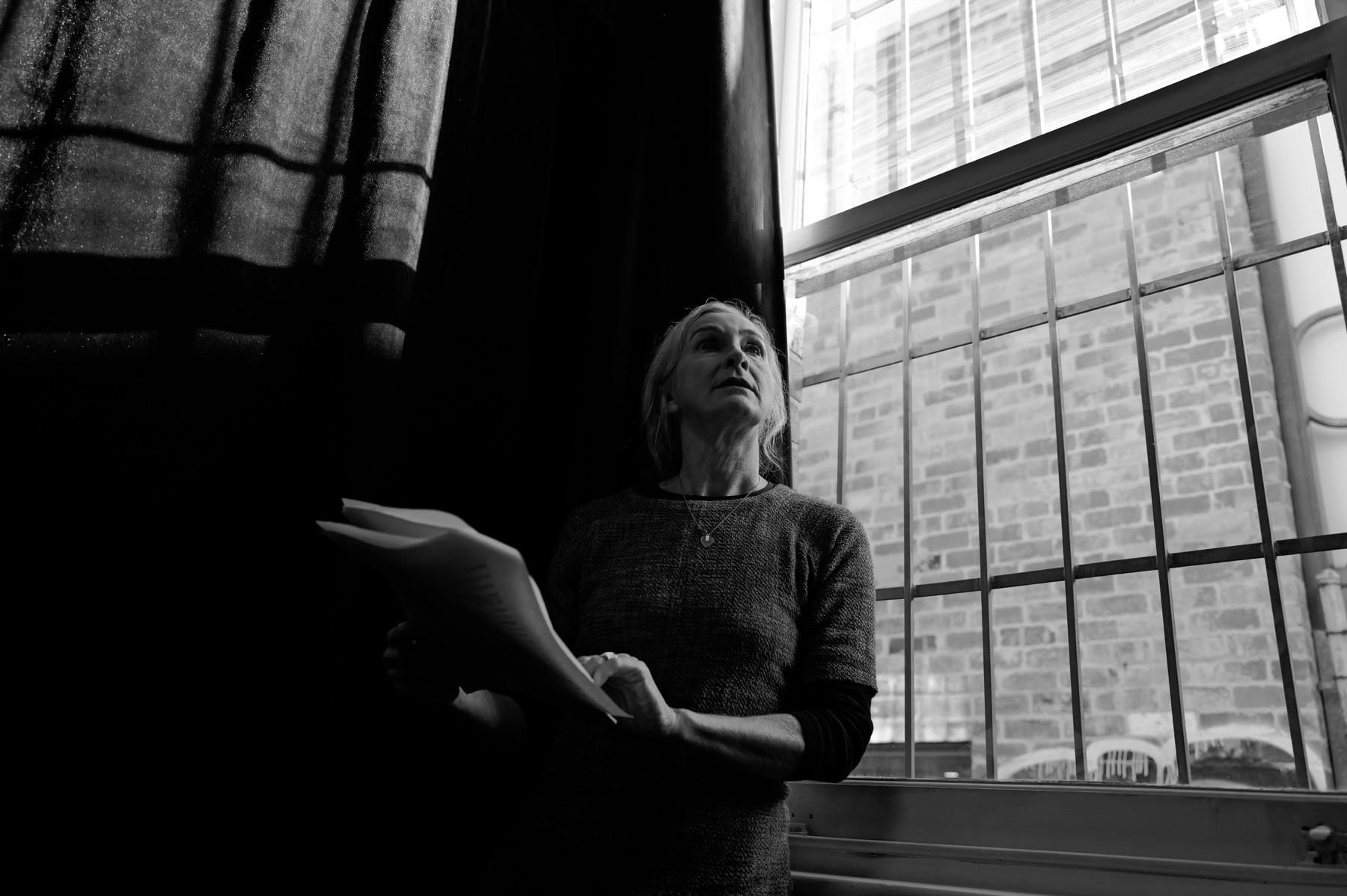 Hamlet performer by a rehearsal-room window