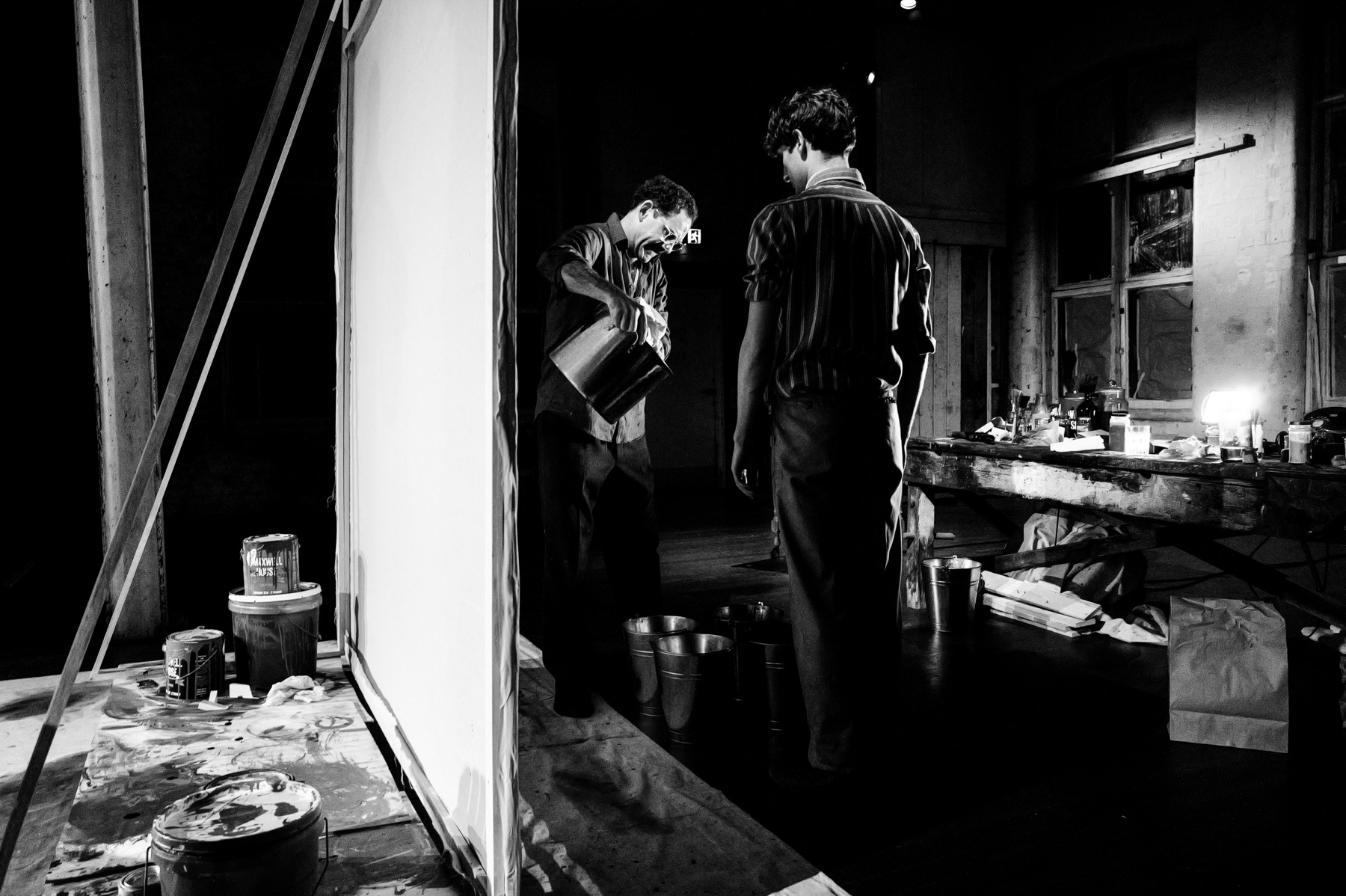Red rehearsal photograph in a studio space